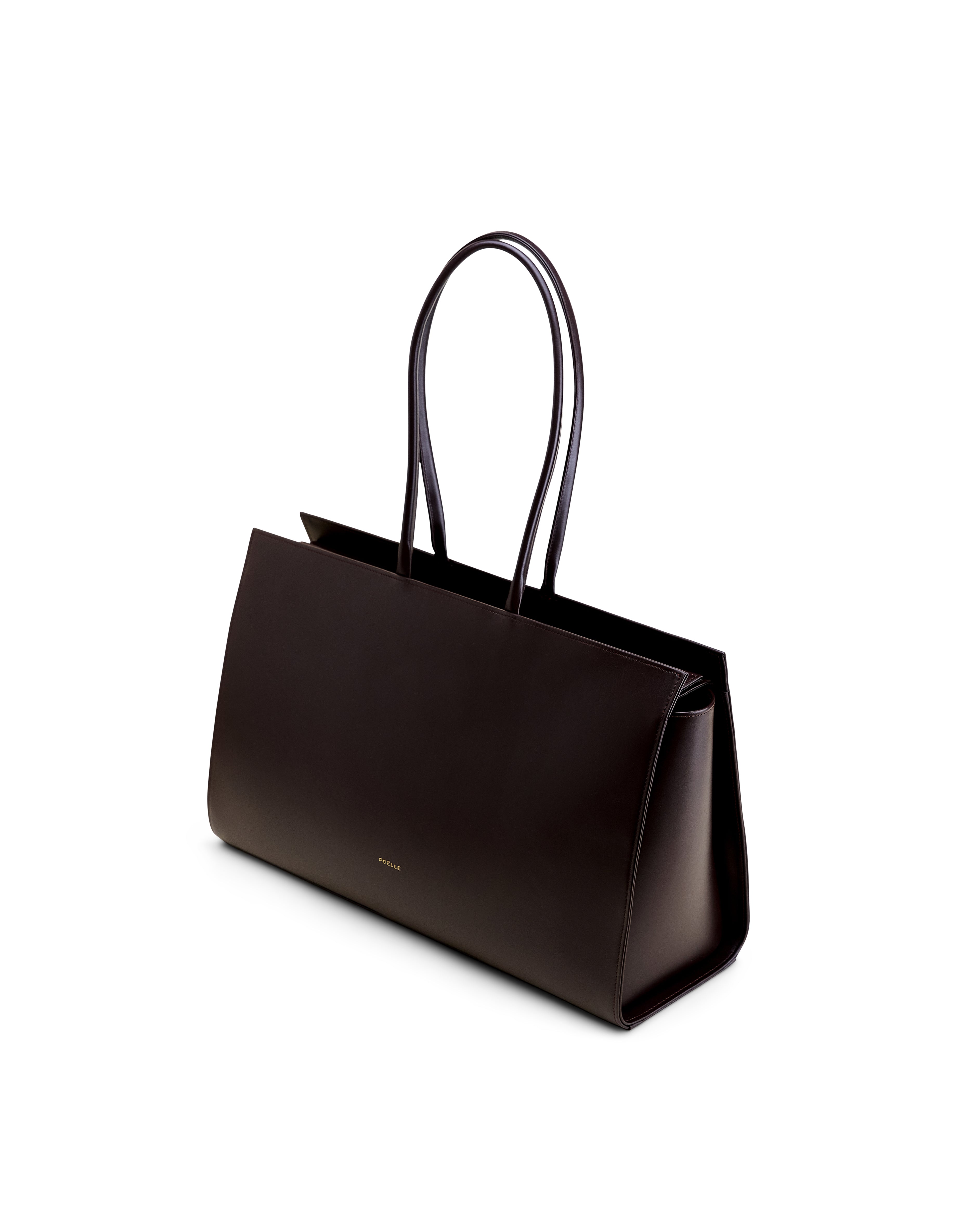 Czarna elegancka tote bag Poelle Atelier ze smukłymi uchwytami i minimalistycznym designem